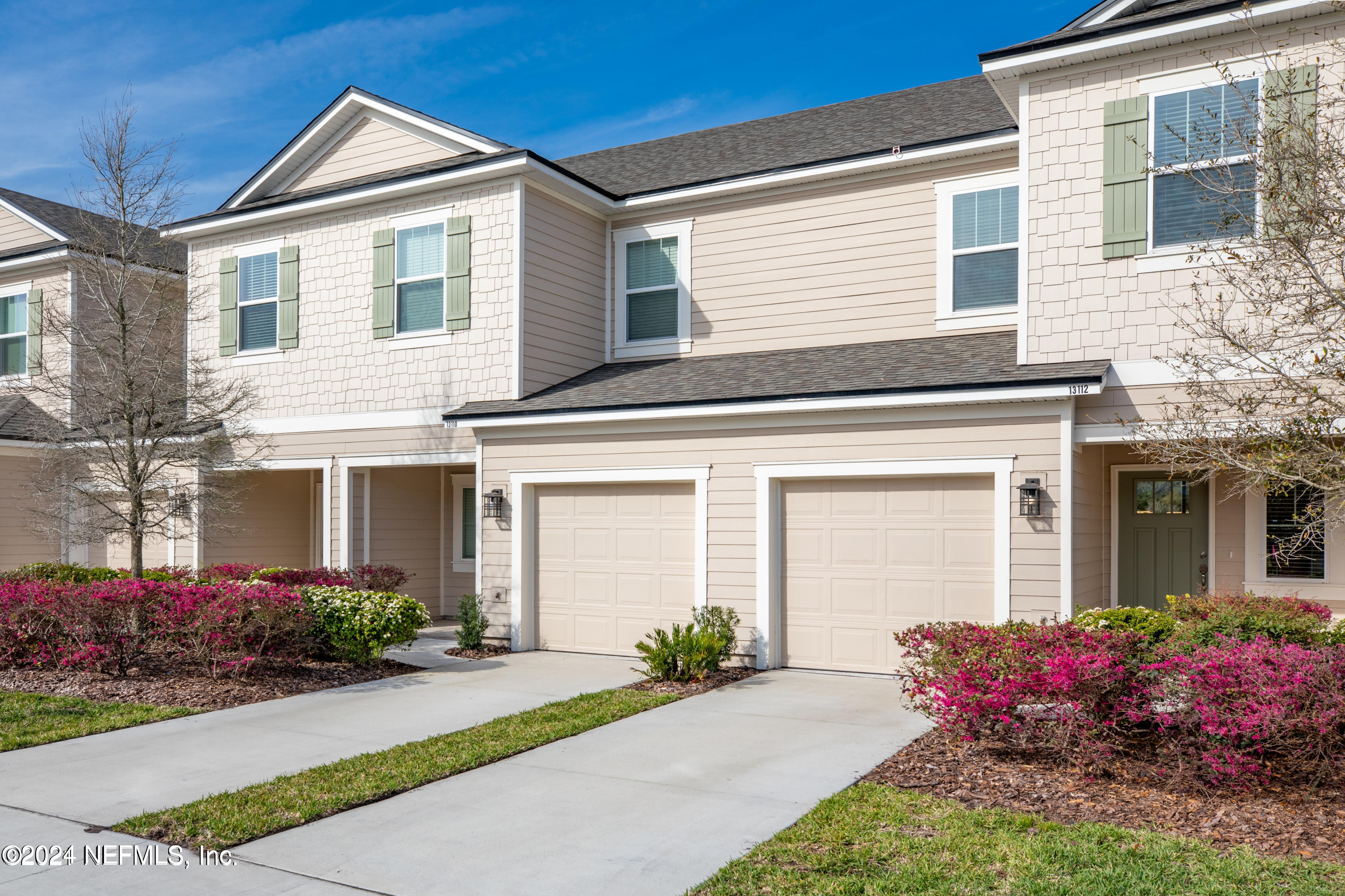 a front view of a house with yard