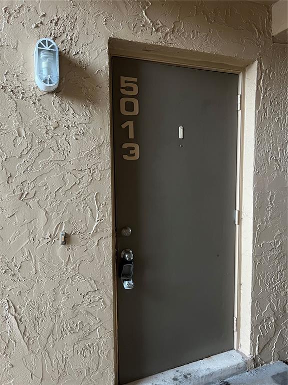 a bathroom with a shower and a sink