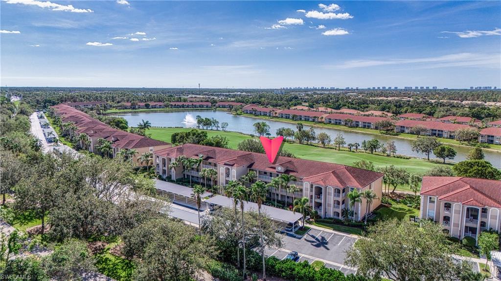 an aerial view of a house with a lake view