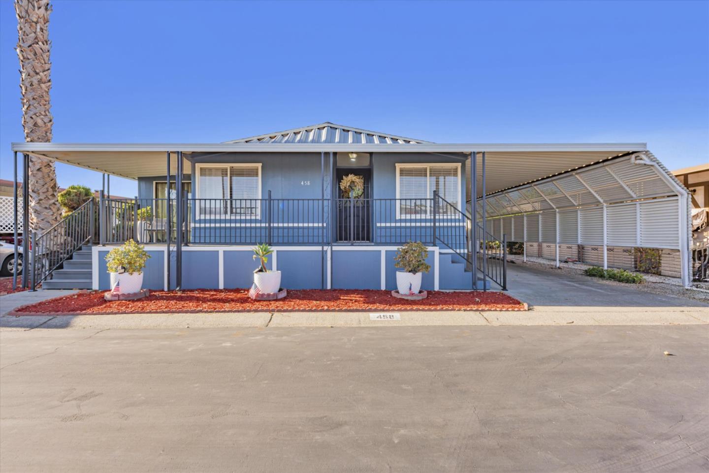 a front view of a house with a yard and street view