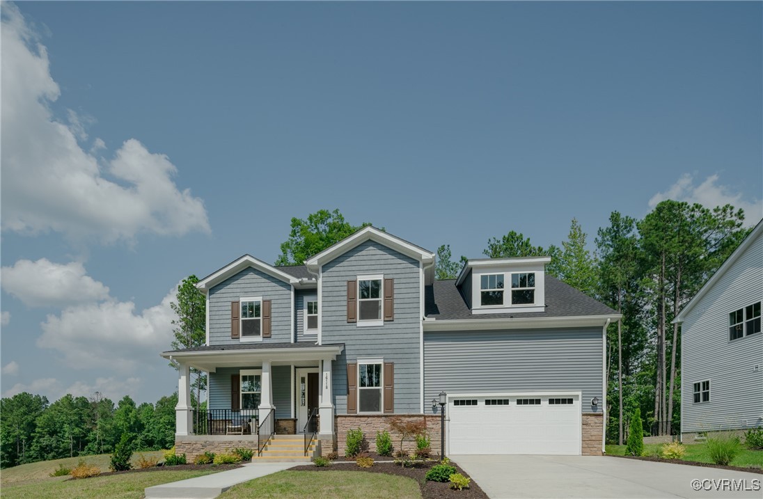 a front view of a residential houses with yard