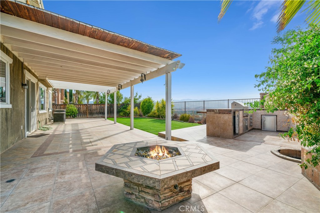 a building outdoor space with patio furniture and garden