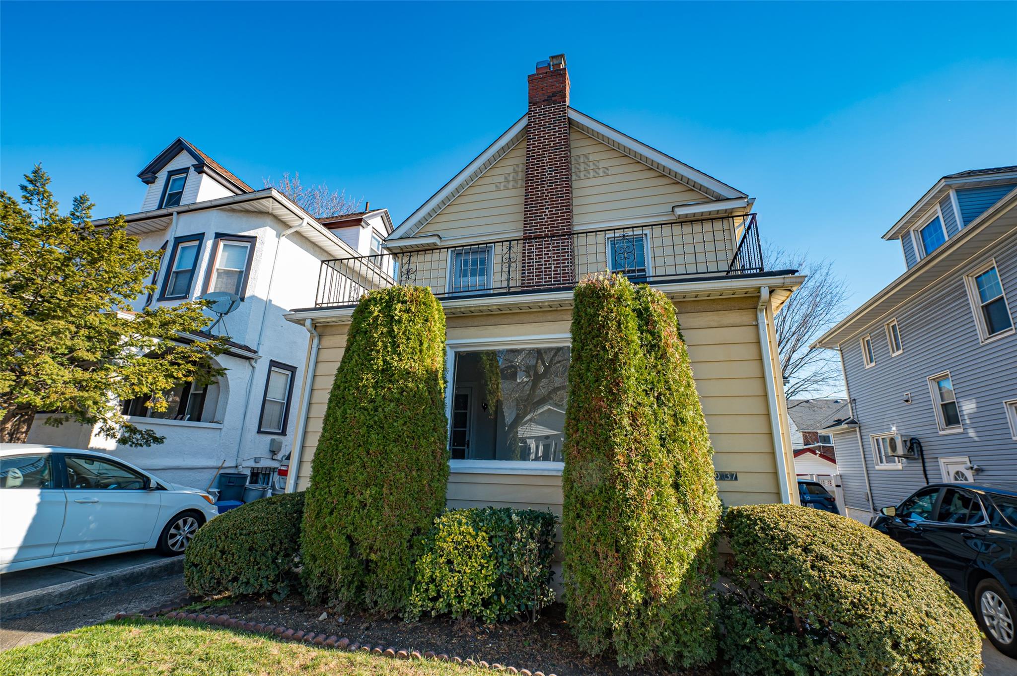 View of front of property with a balcony