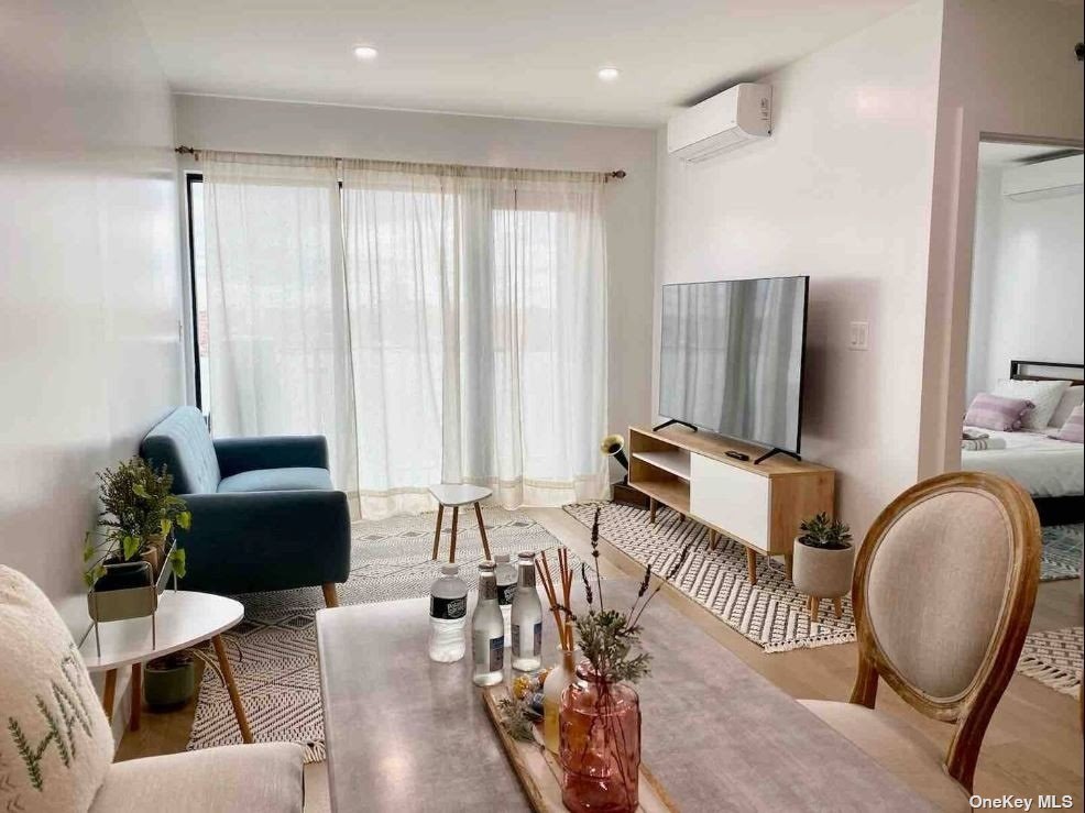 a living room with furniture and a large mirror