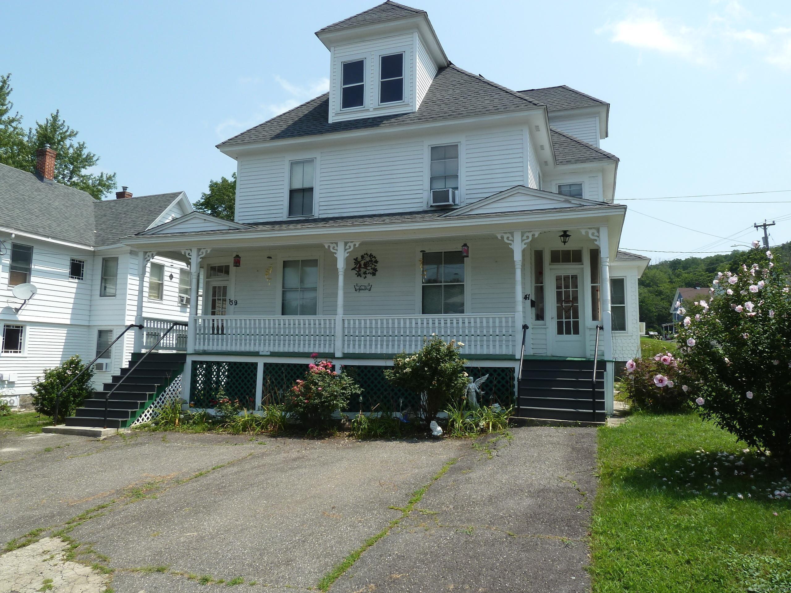 a front view of a house with yard