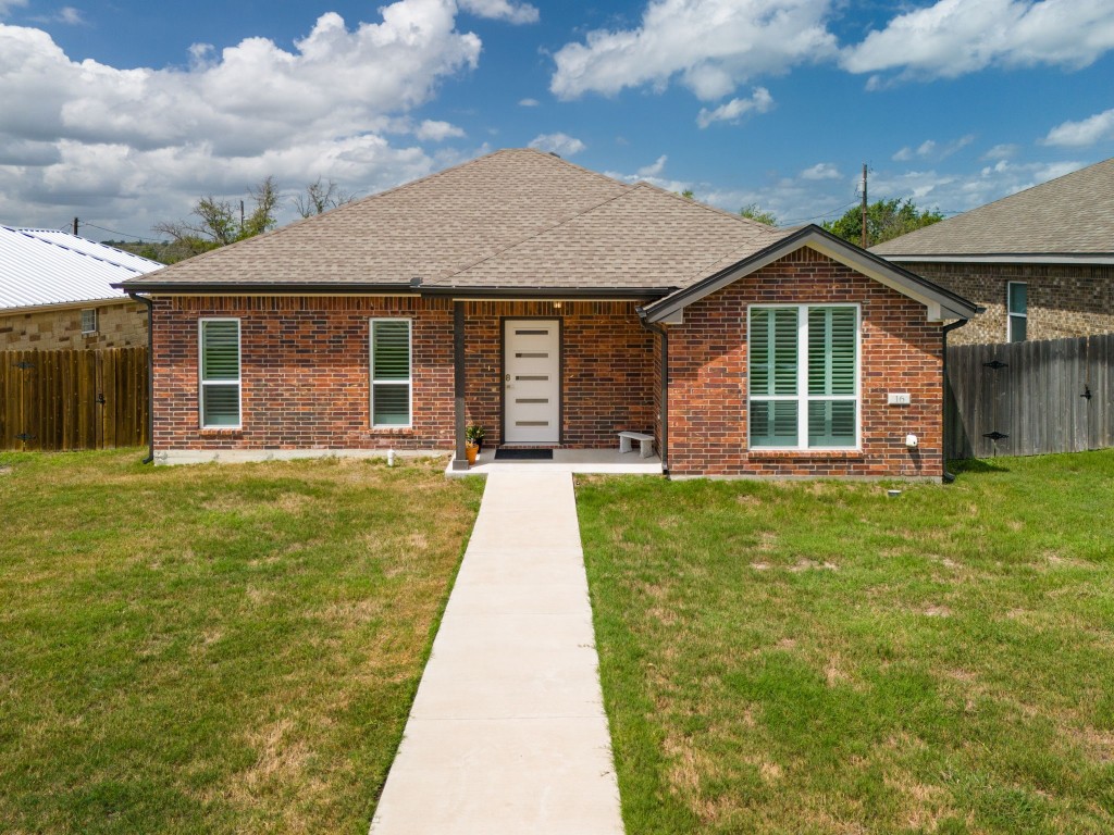 a front view of a house with yard