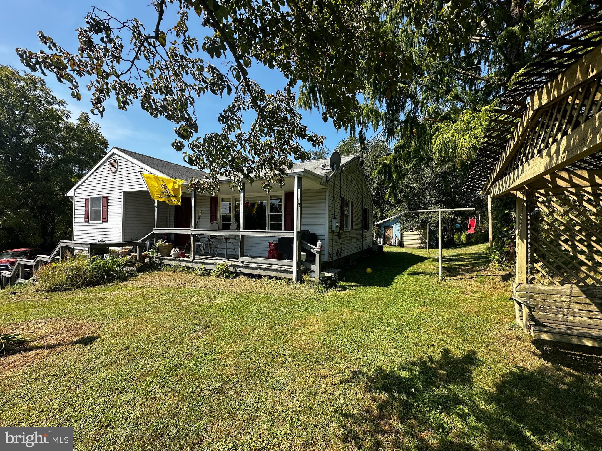 a view of a house with swimming pool and sitting area