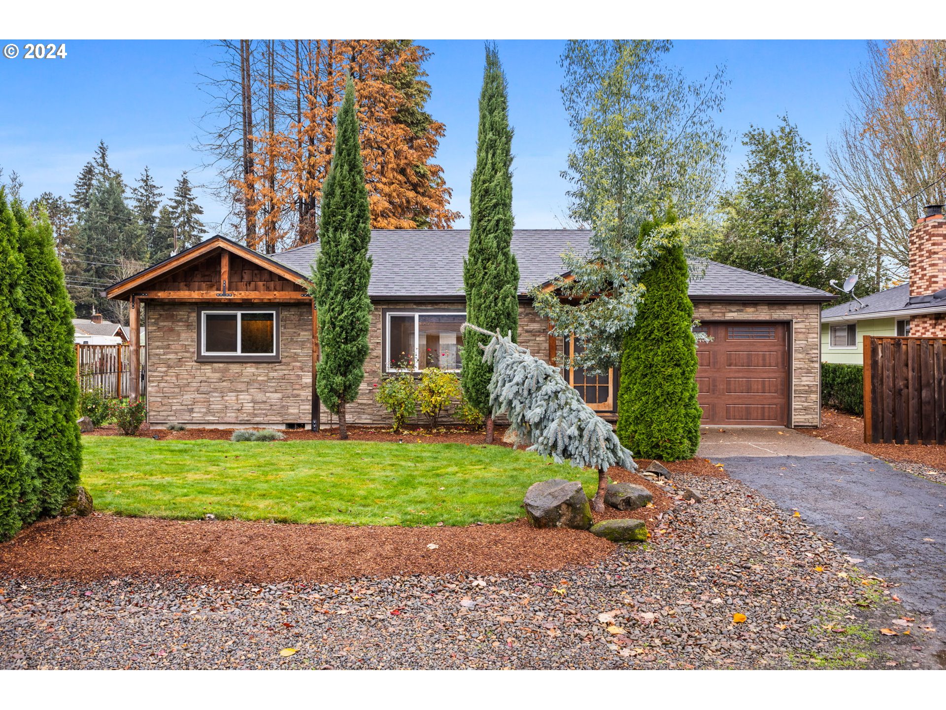 a front view of a house with garden