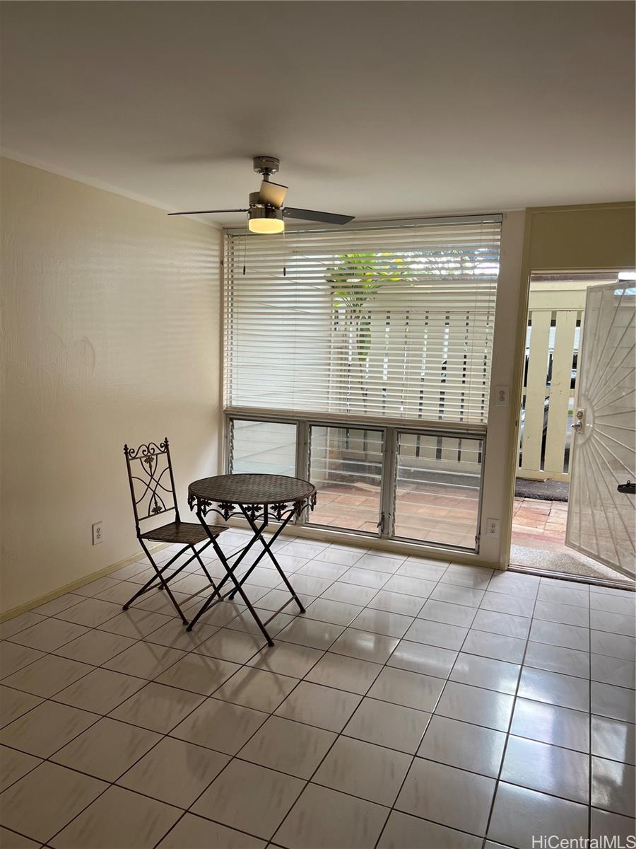 The main entrance door showing the tile flooring of dining area.