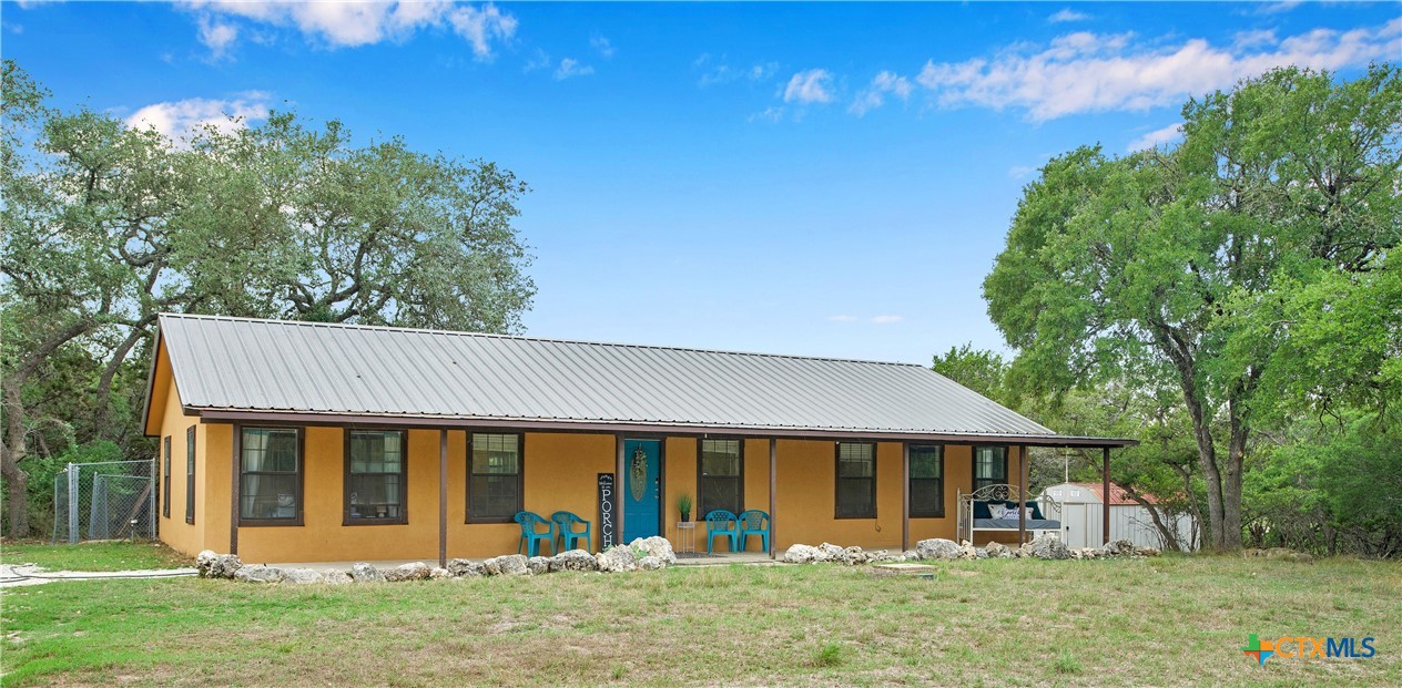 front view of a house with a yard