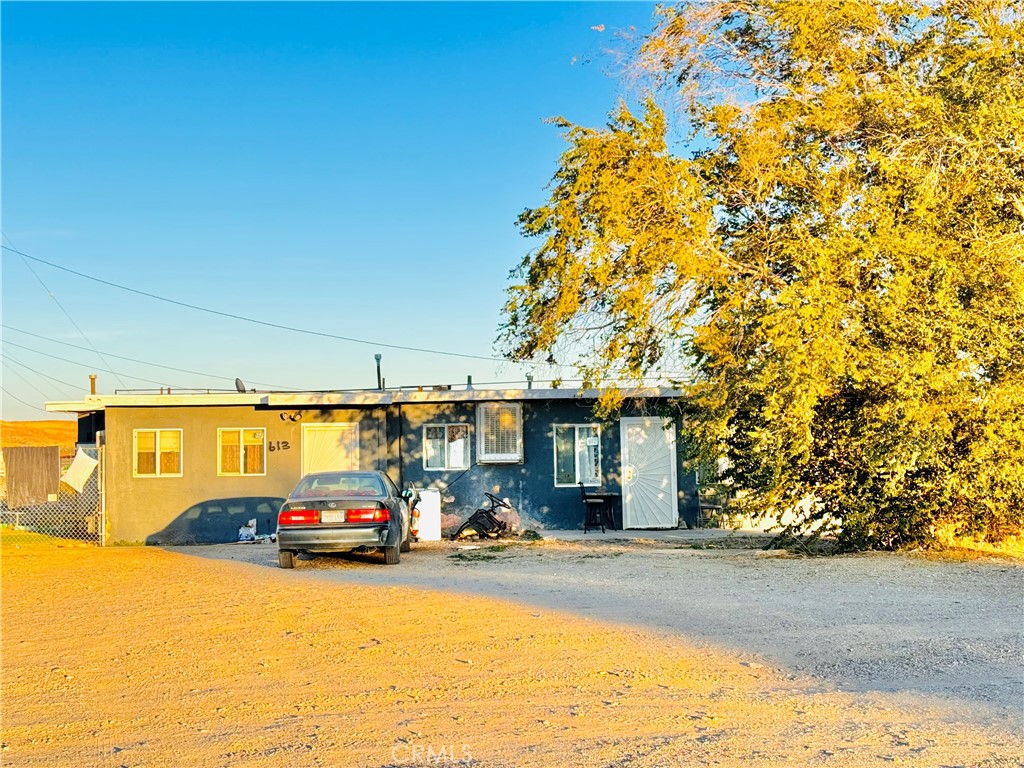 a view of a car parked in front of a building