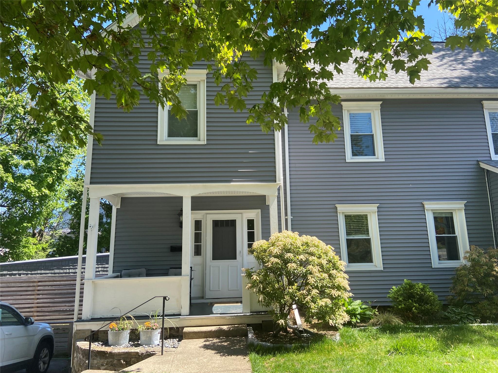 a front view of a house with garden