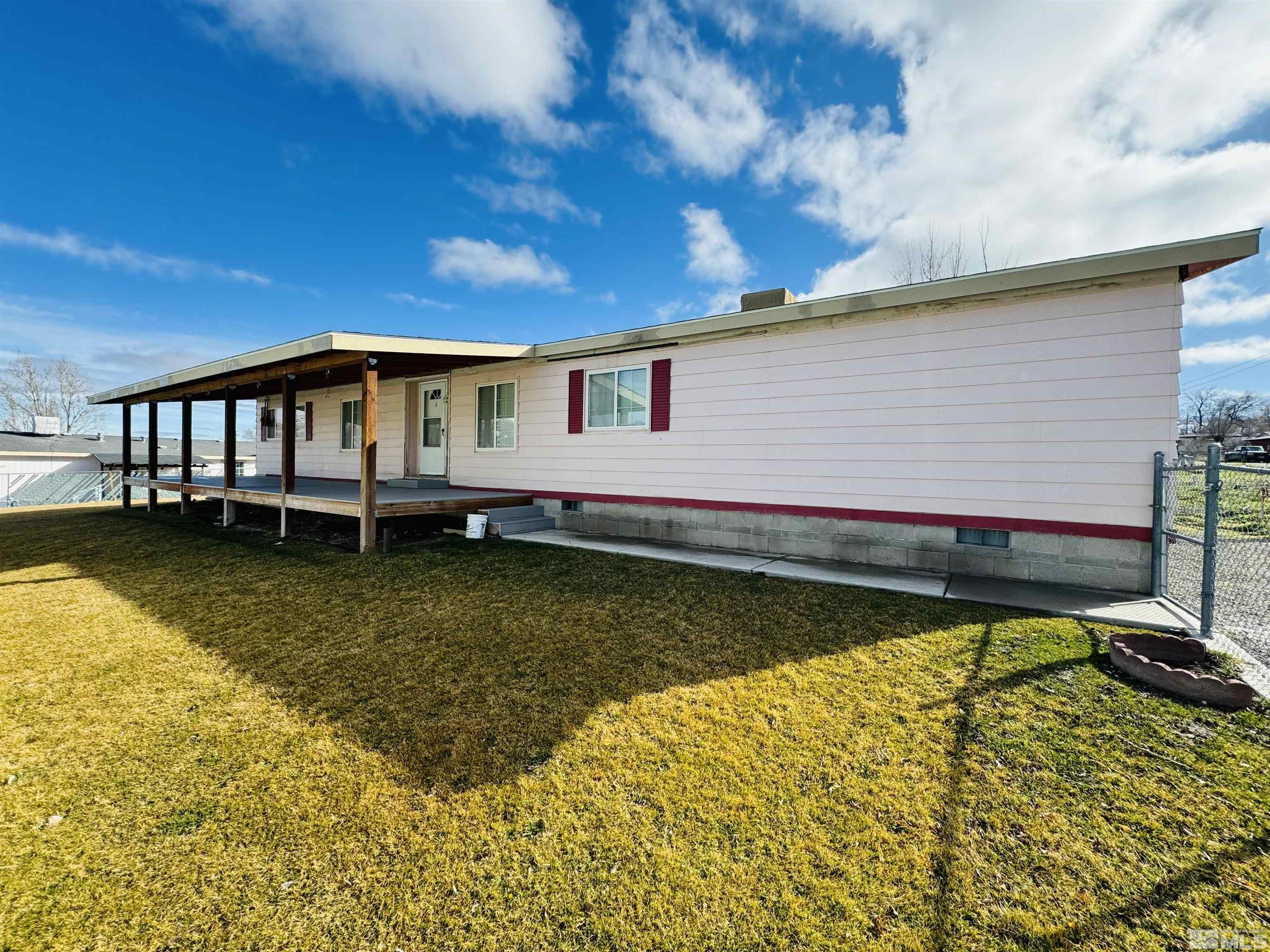 a view of a house with pool and wooden floor