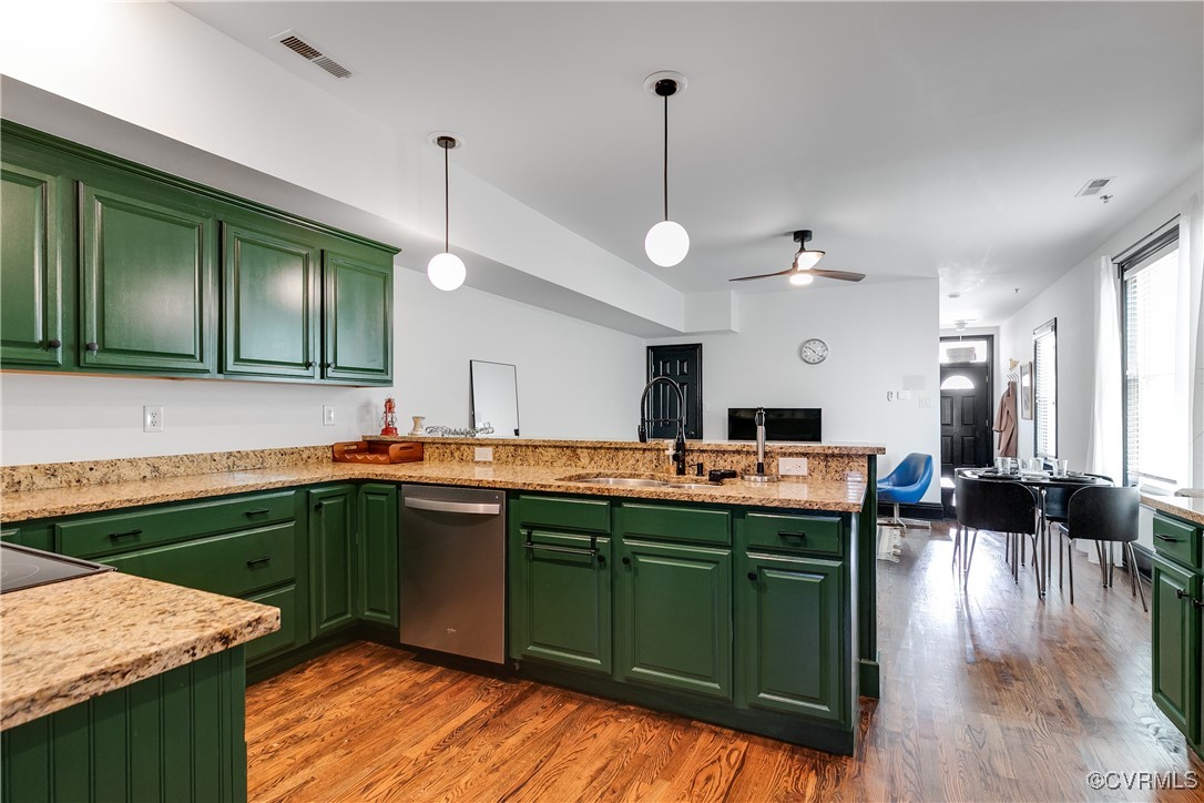 a kitchen with kitchen island stainless steel appliances a sink stove and refrigerator