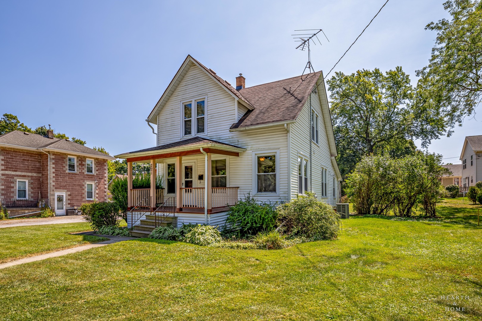 a front view of a house with a yard table and chairs