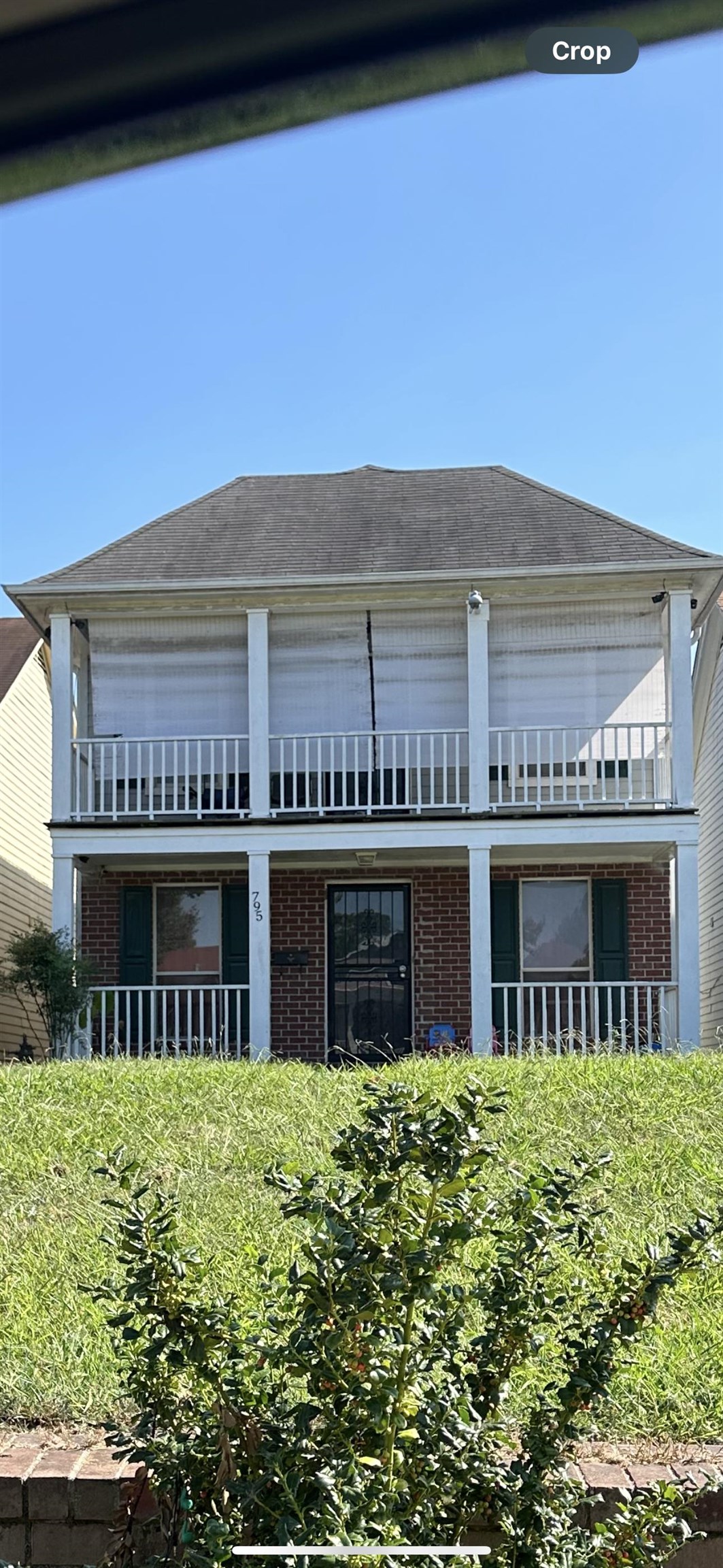 a front view of building with yard