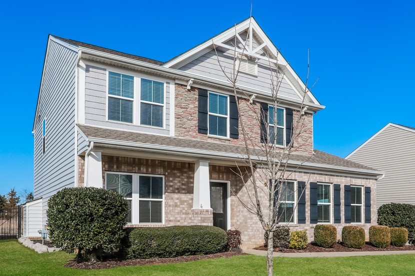 front view of a house with a yard