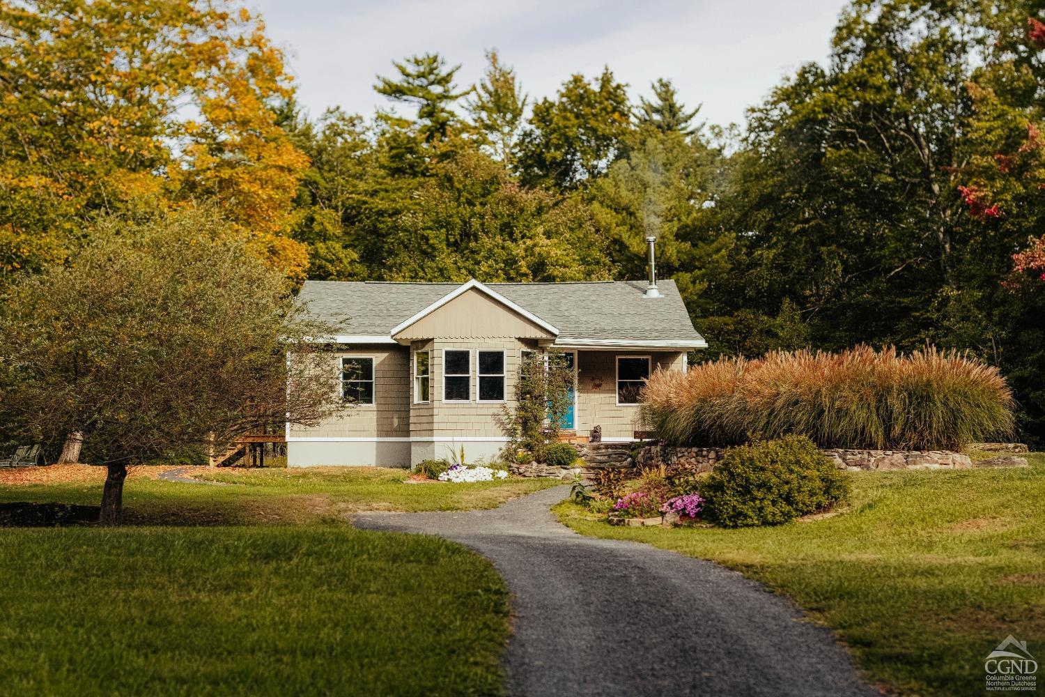 a front view of a house with a yard