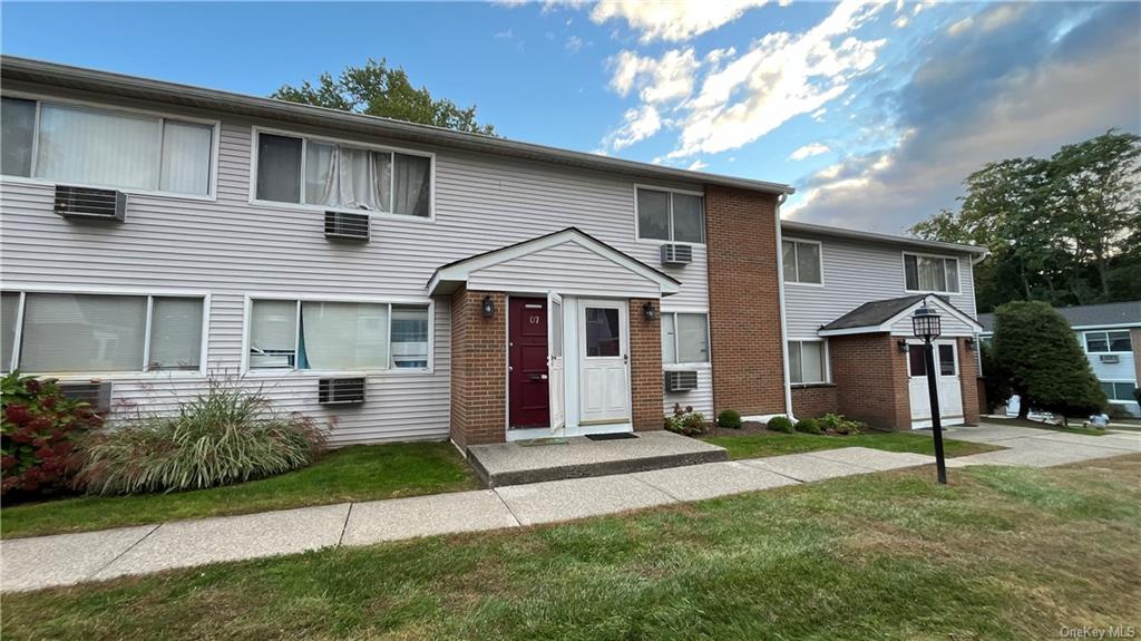 View of front of property with a front lawn