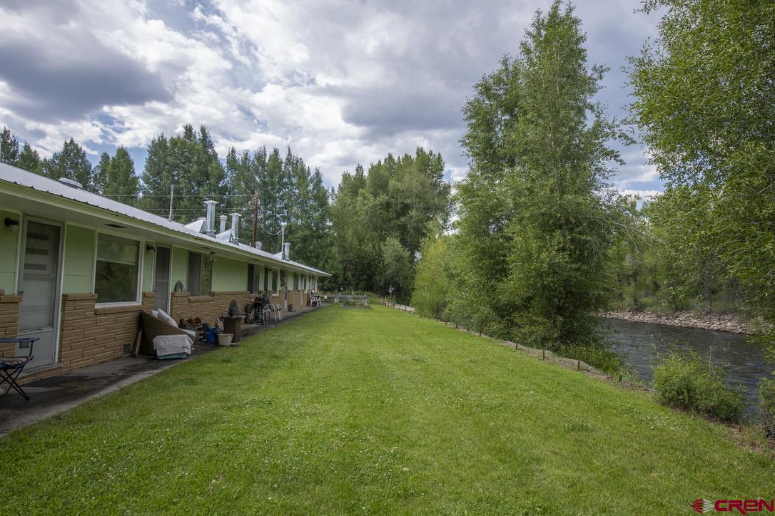 a backyard of a house with lots of green space