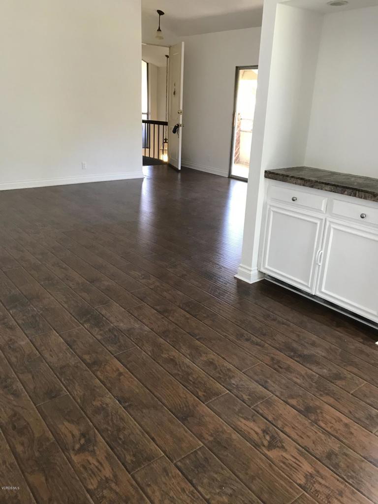 a view of a livingroom with wooden floor