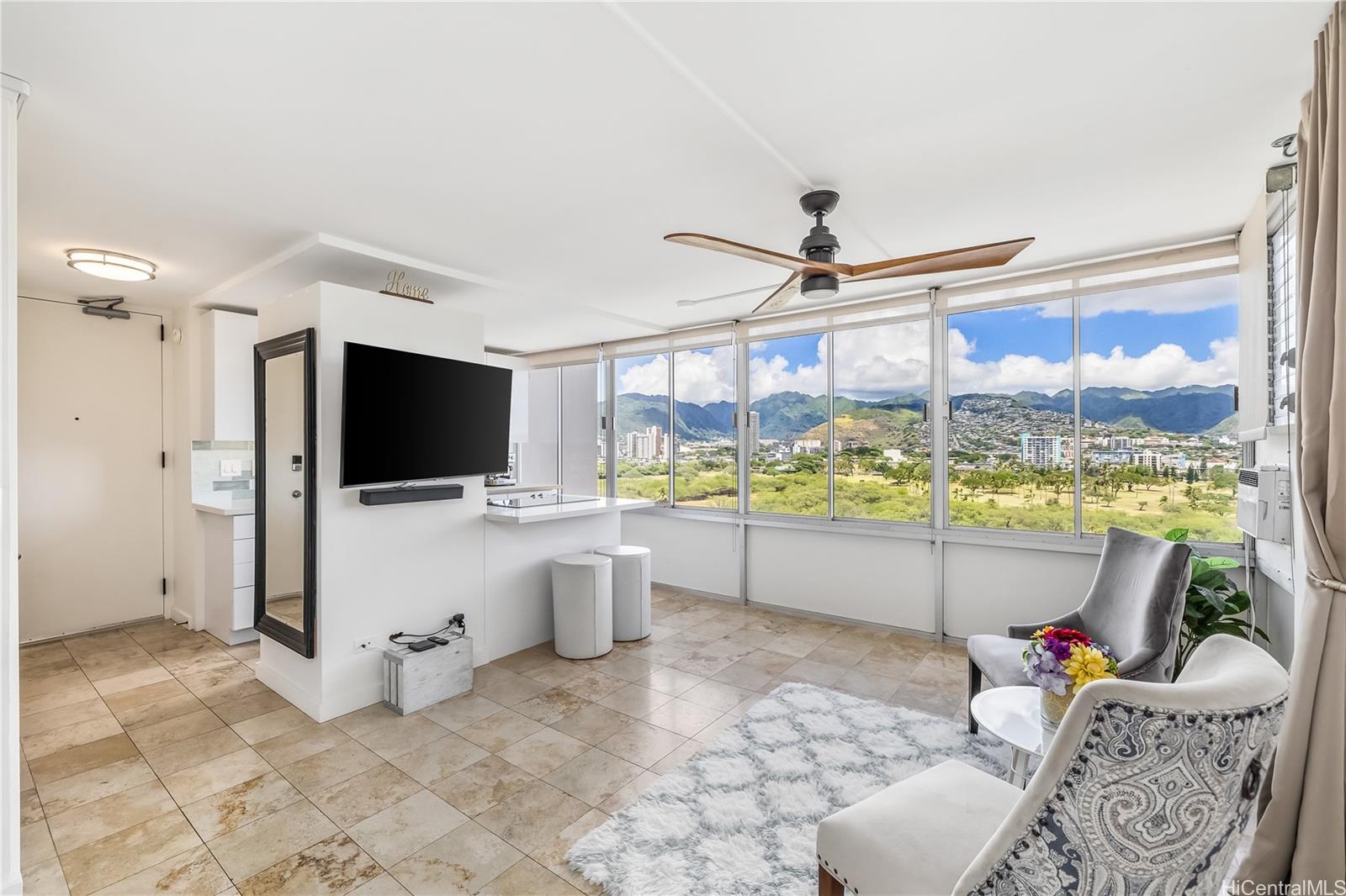 a living room with furniture and a flat screen tv