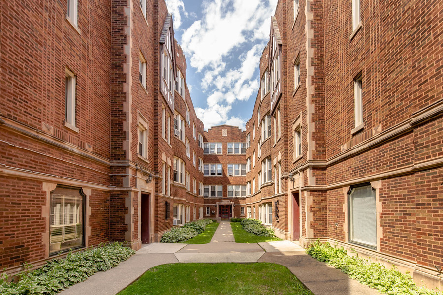 a view of a building with a yard