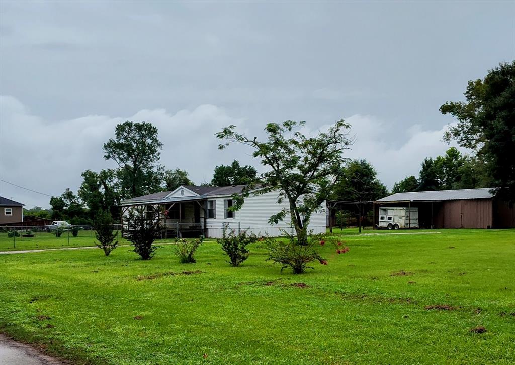 a view of a house with a big yard