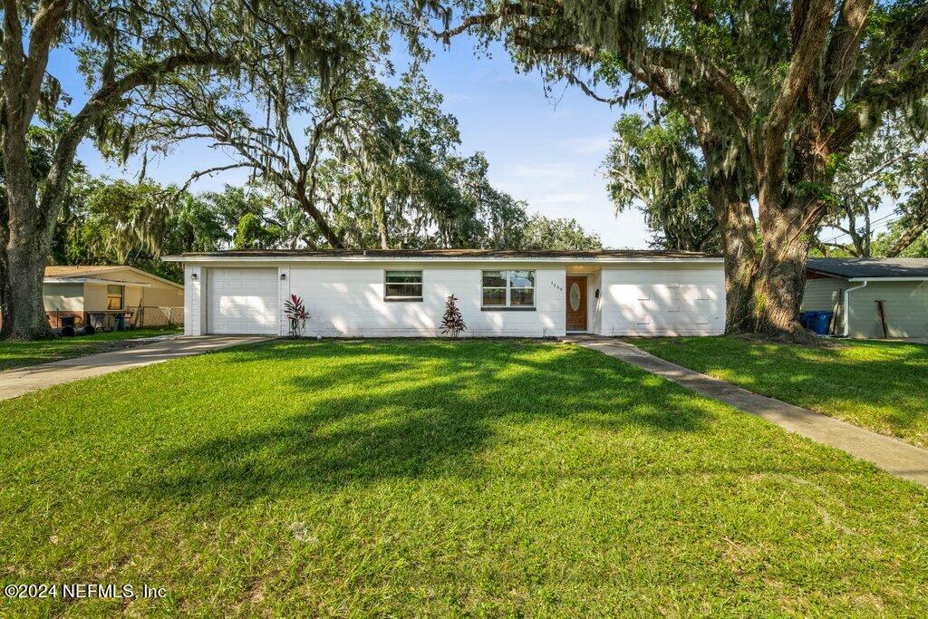 a front view of house with yard and seating area