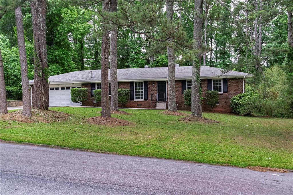 front view of a house with a yard