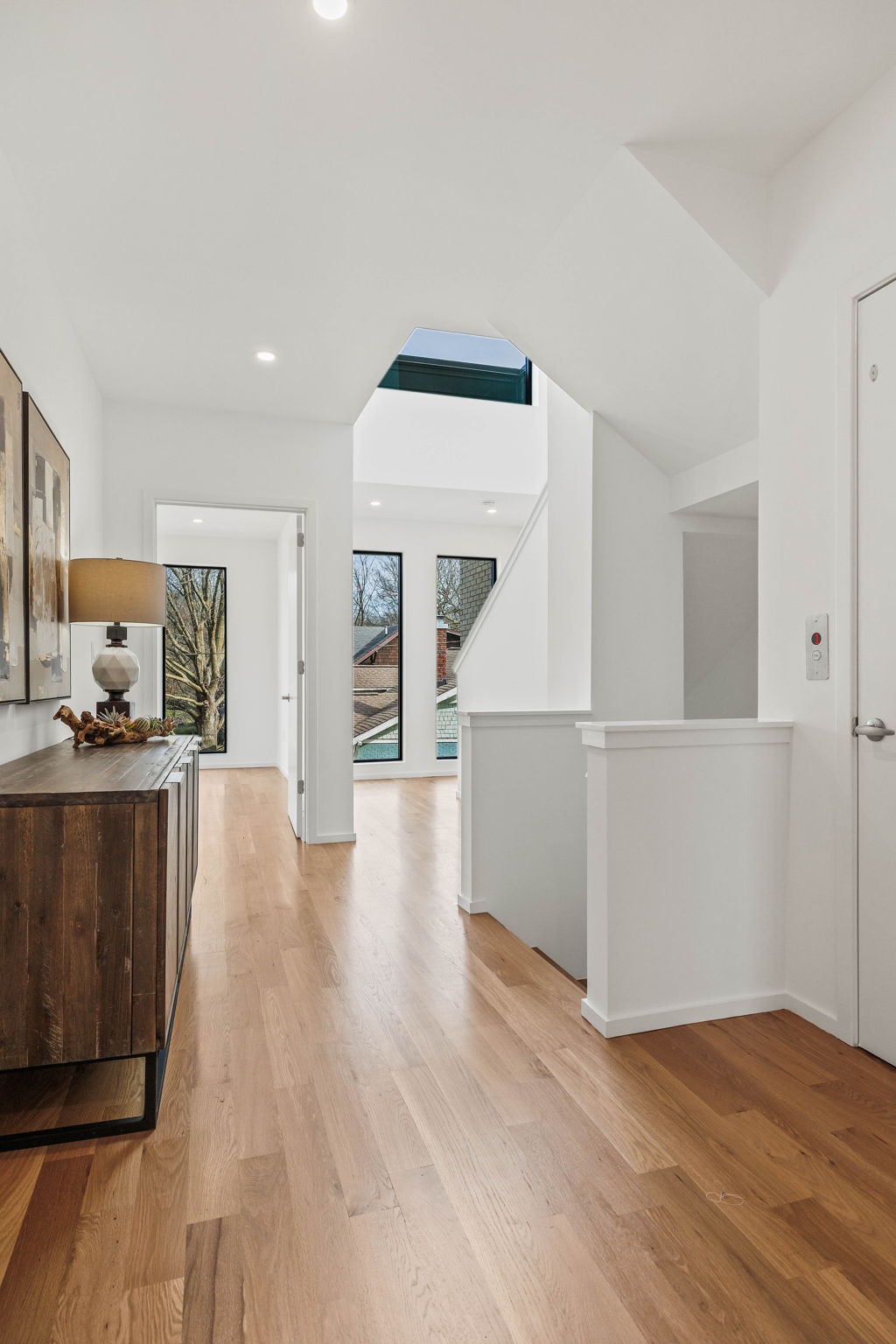 a view of a kitchen with wooden floor and electronic appliances