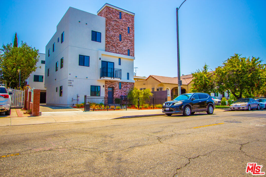 a view of a street with cars