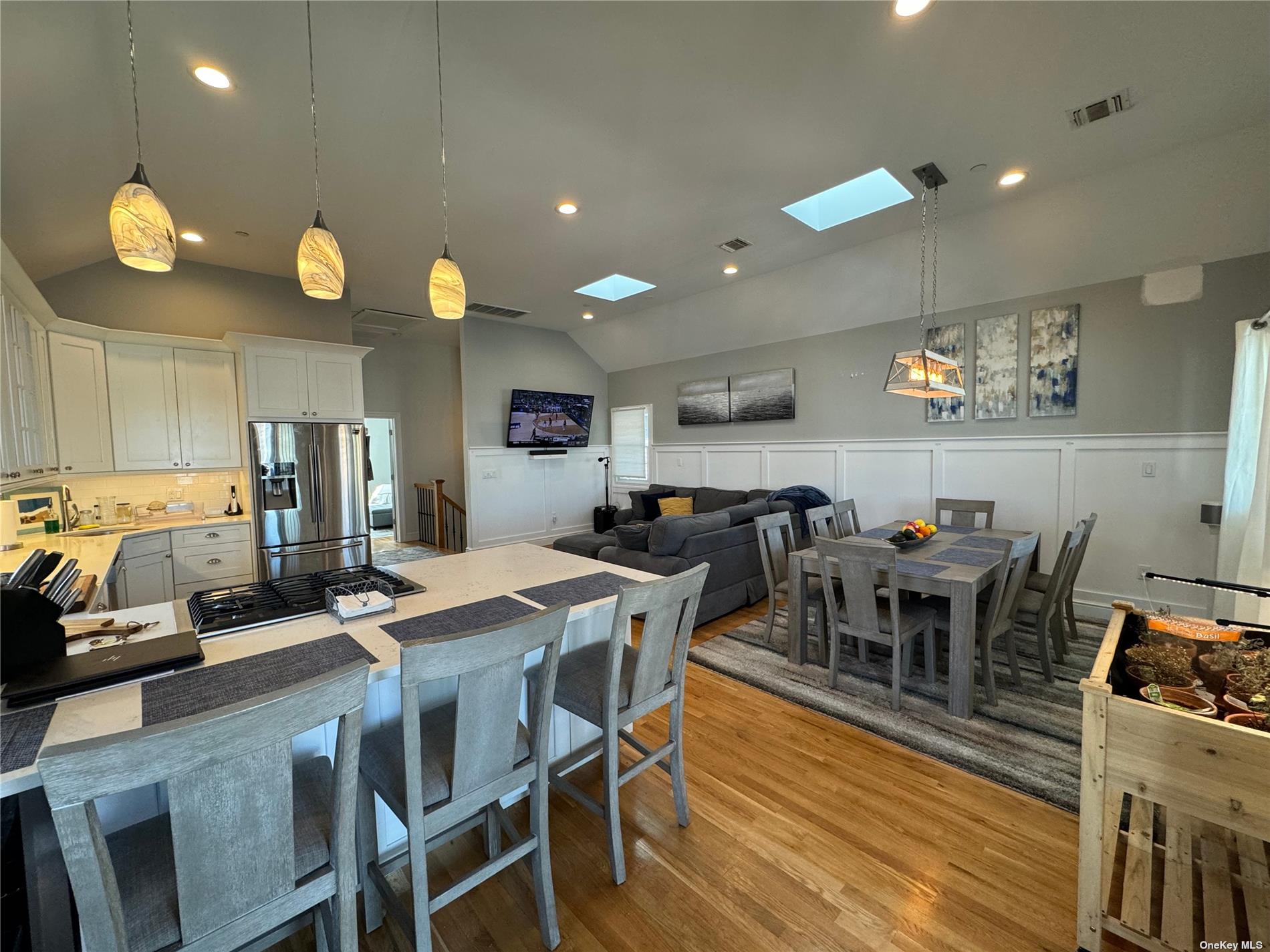 a view of a dining area with furniture and wooden floor