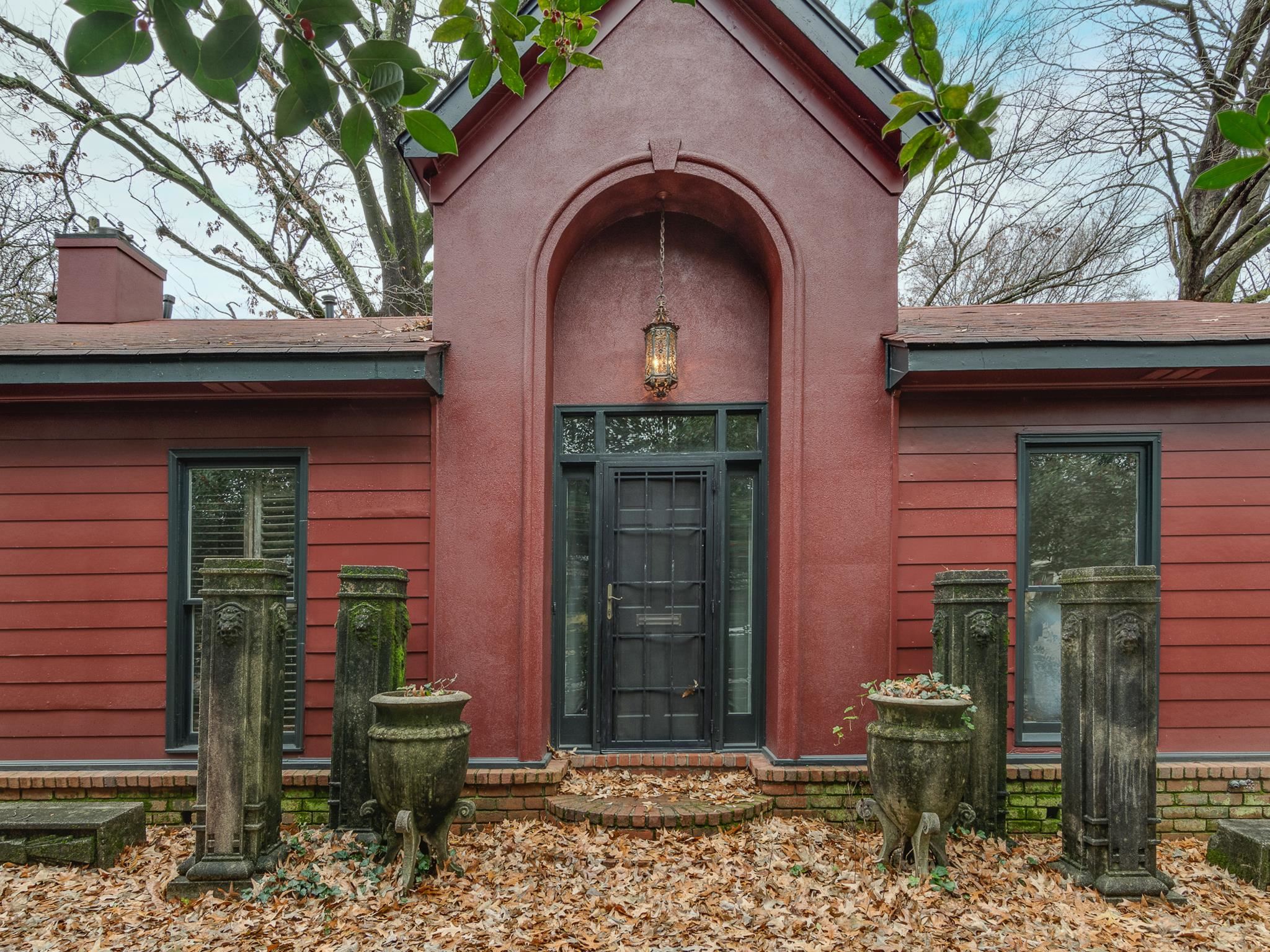 a front view of a house with garden