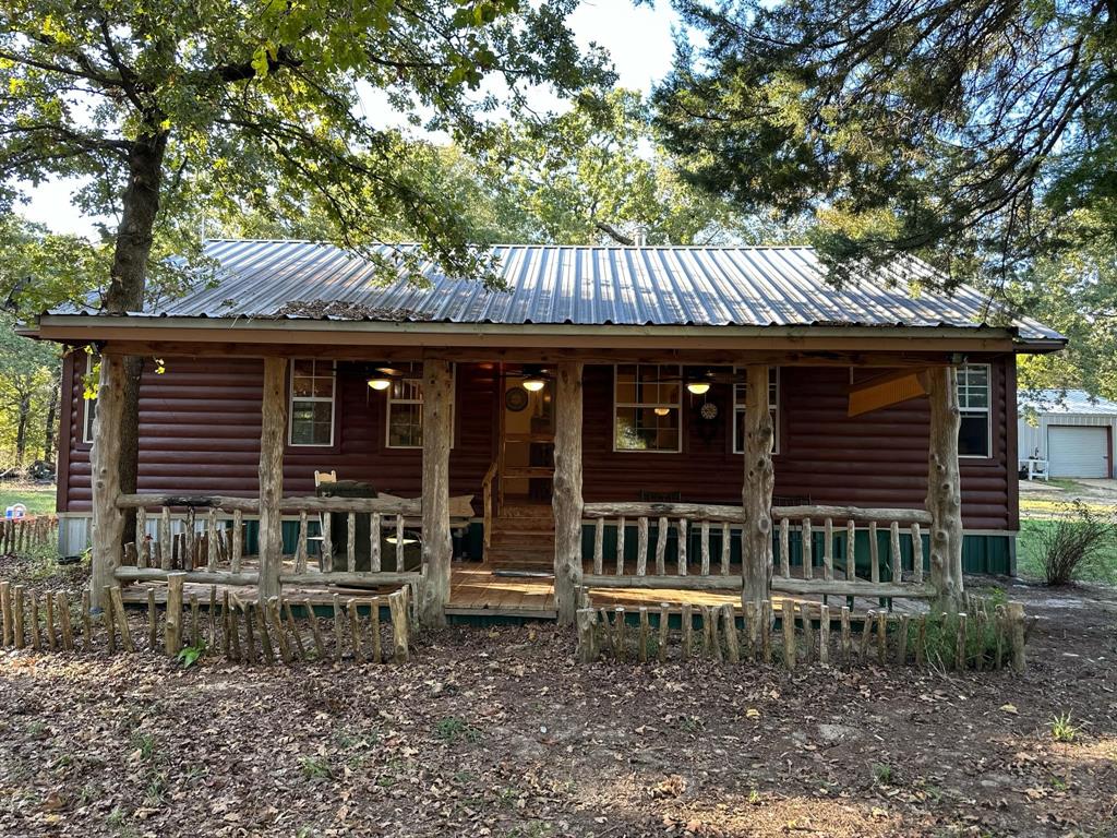 a view of a house with a bench in a patio