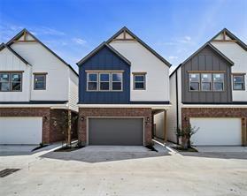 a front view of a house with garage