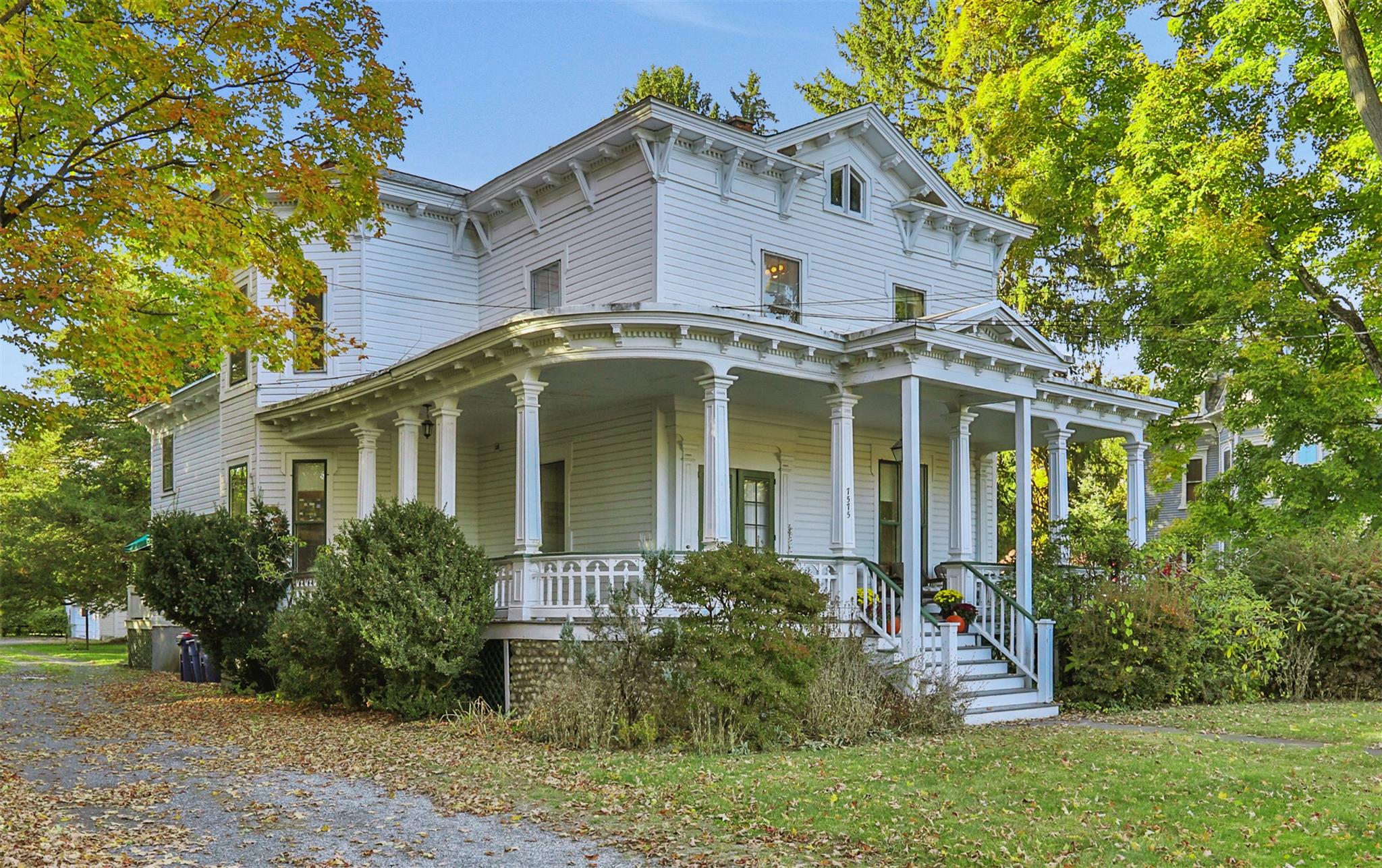 Classic Victorian house featuring a wrap-around porch