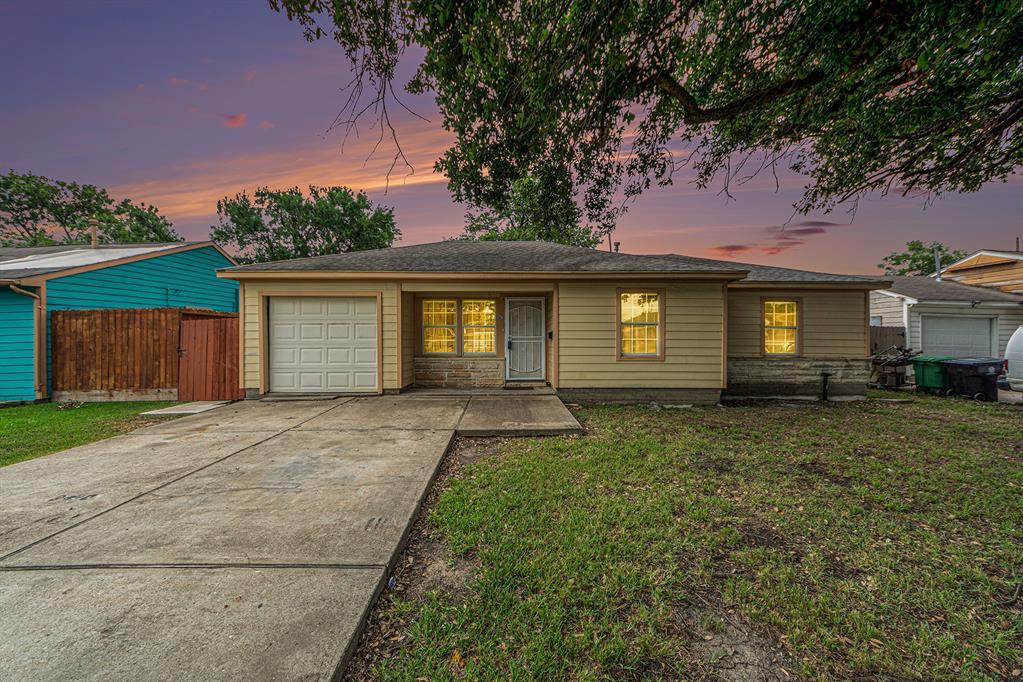 front view of a house with a yard