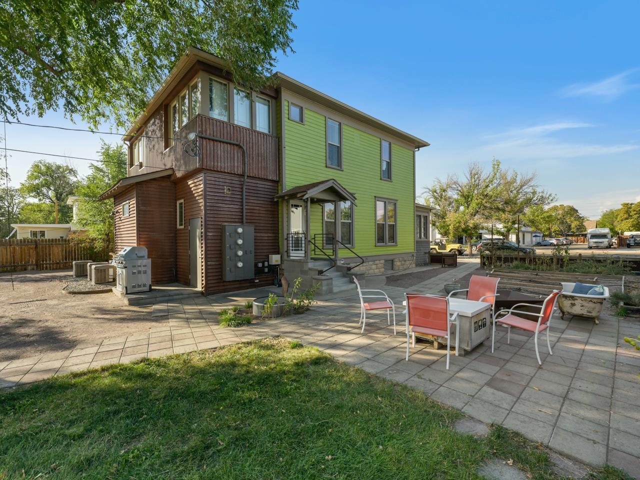 a view of a house with backyard porch and sitting area