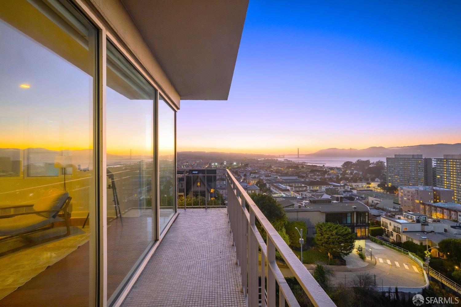 a view of a balcony with an ocean view