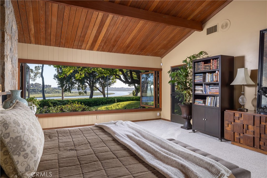 a view of a porch with furniture and garden