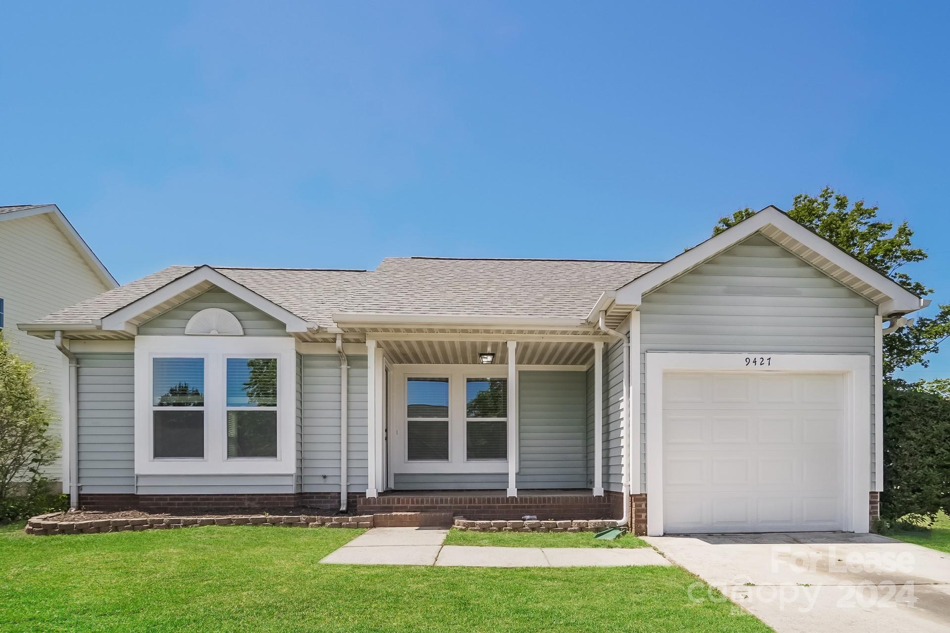 front view of a house with a yard