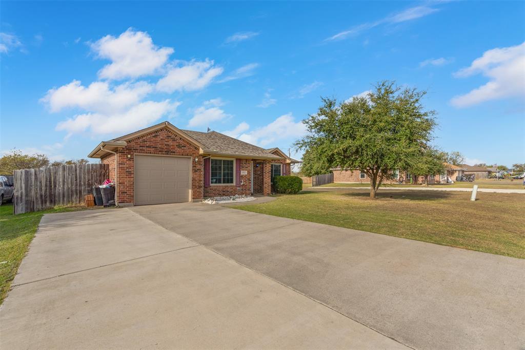 a view of house with yard and entertaining space