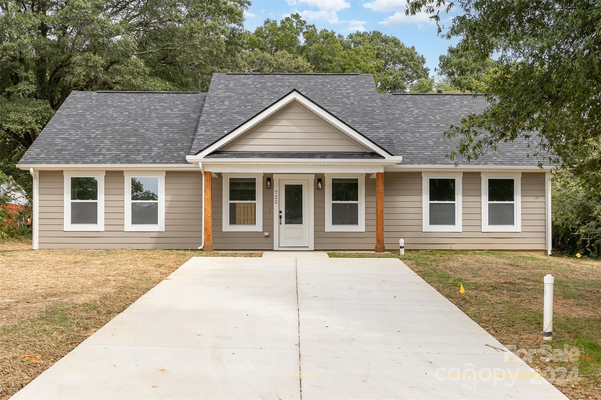 a house with trees in the background