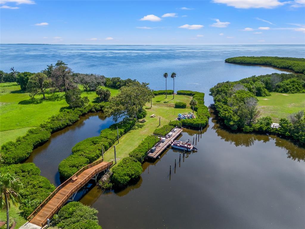 a view of a lake with a yard