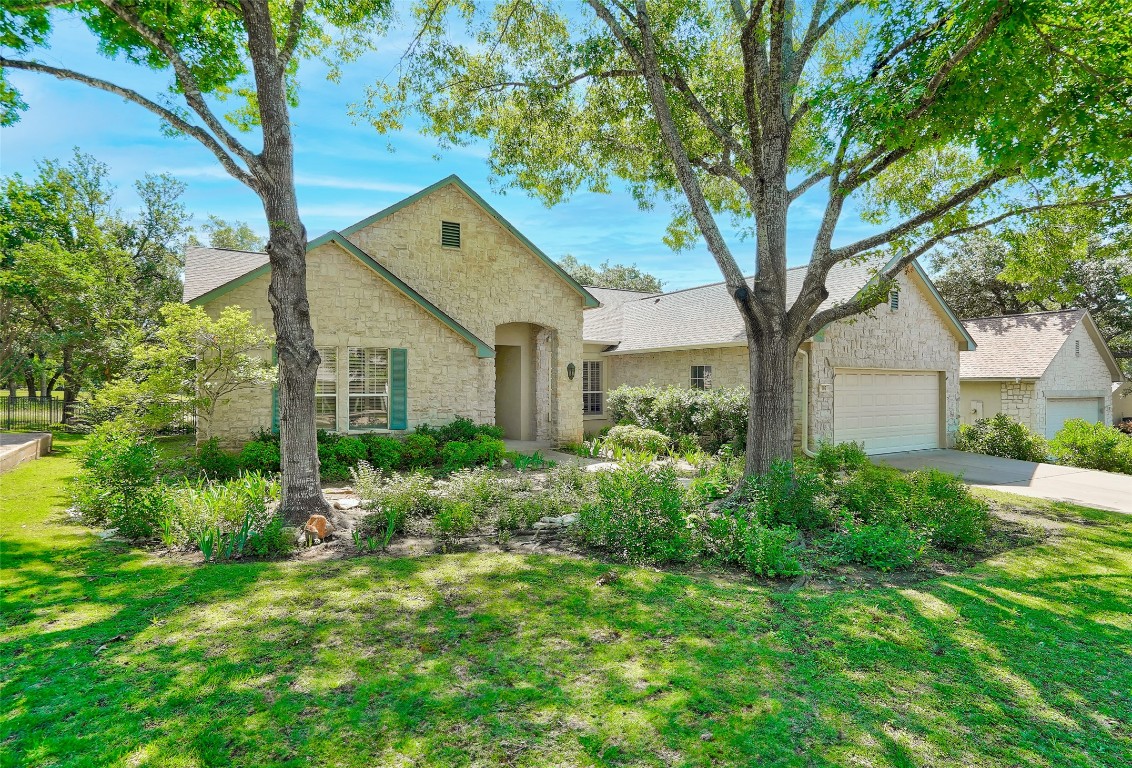 a front view of a house with garden