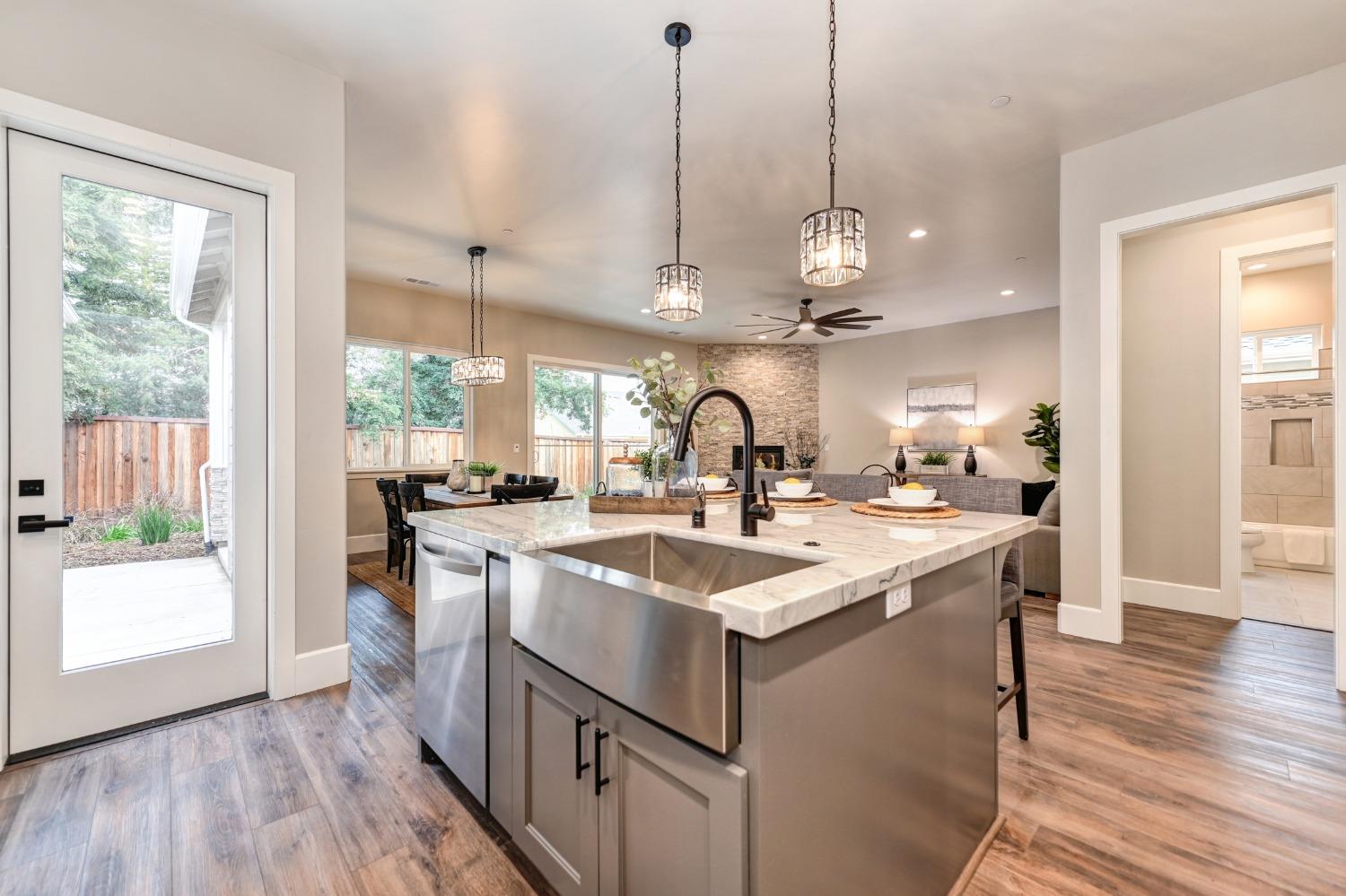 a kitchen with a sink and stove