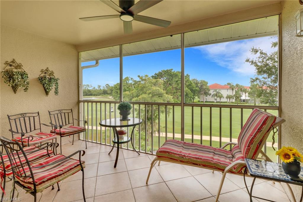 a view of a chairs and table in the balcony