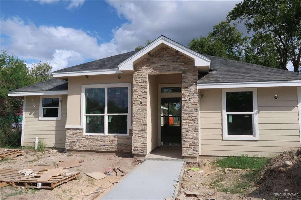 View of front of home featuring a lawn