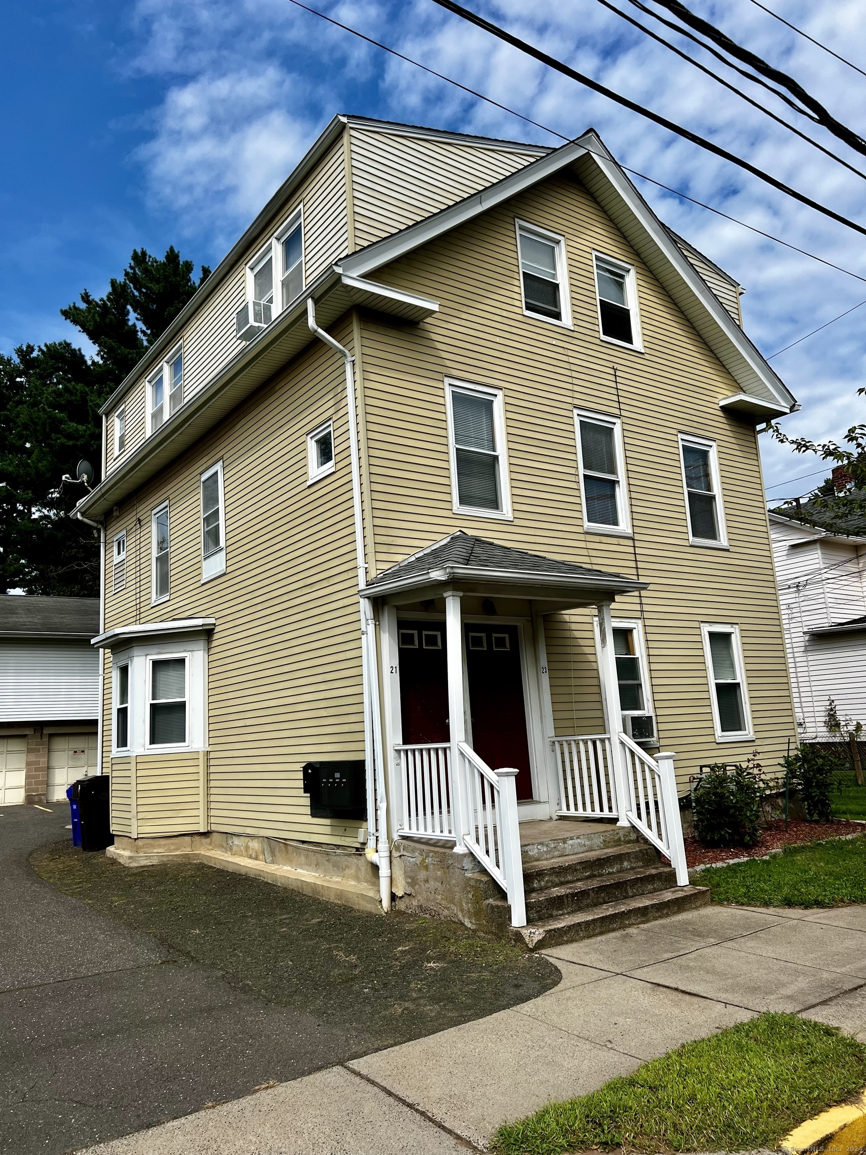 a front view of a house with a garage